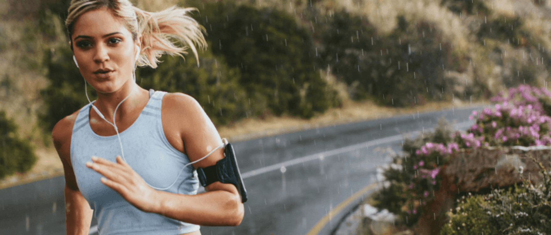 Female runner in an outdoor setting, focusing on endurance and recovery.