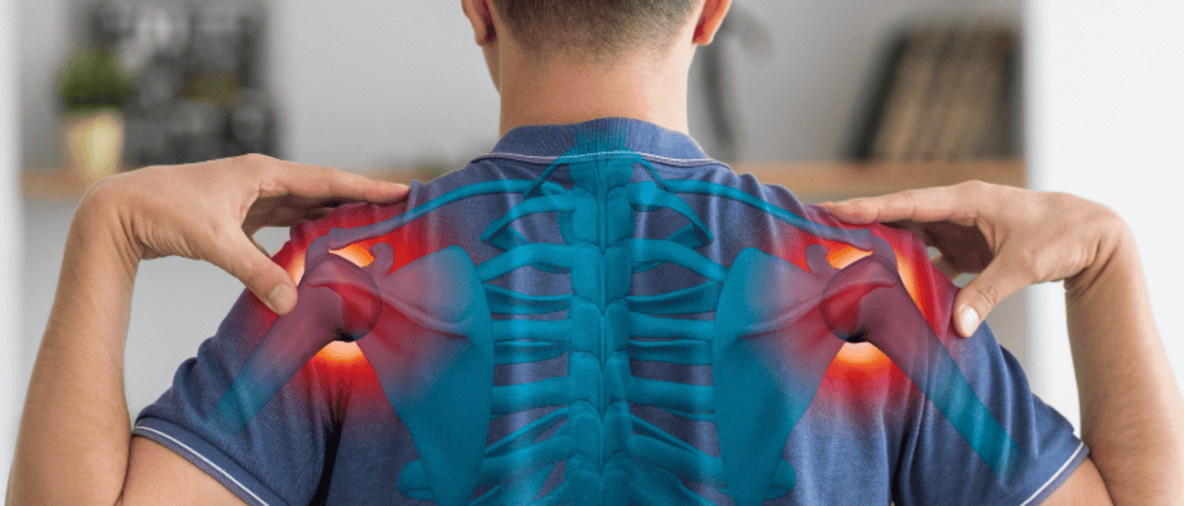 Person experiencing upper back pain due to chronic inflammation.