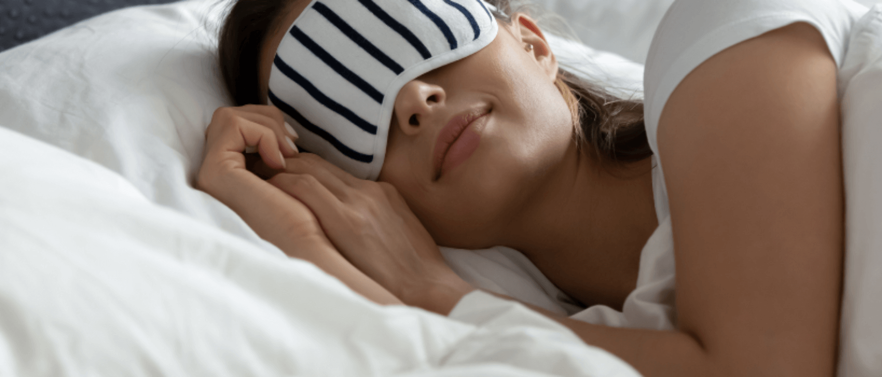 Woman peacefully sleeping, representing restorative sleep benefits