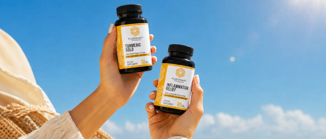 Hands holding Fusionary Formulas Turmeric Gold and Inflammation Relief supplements against a blue sky, representing intentional curcumin-based formulation