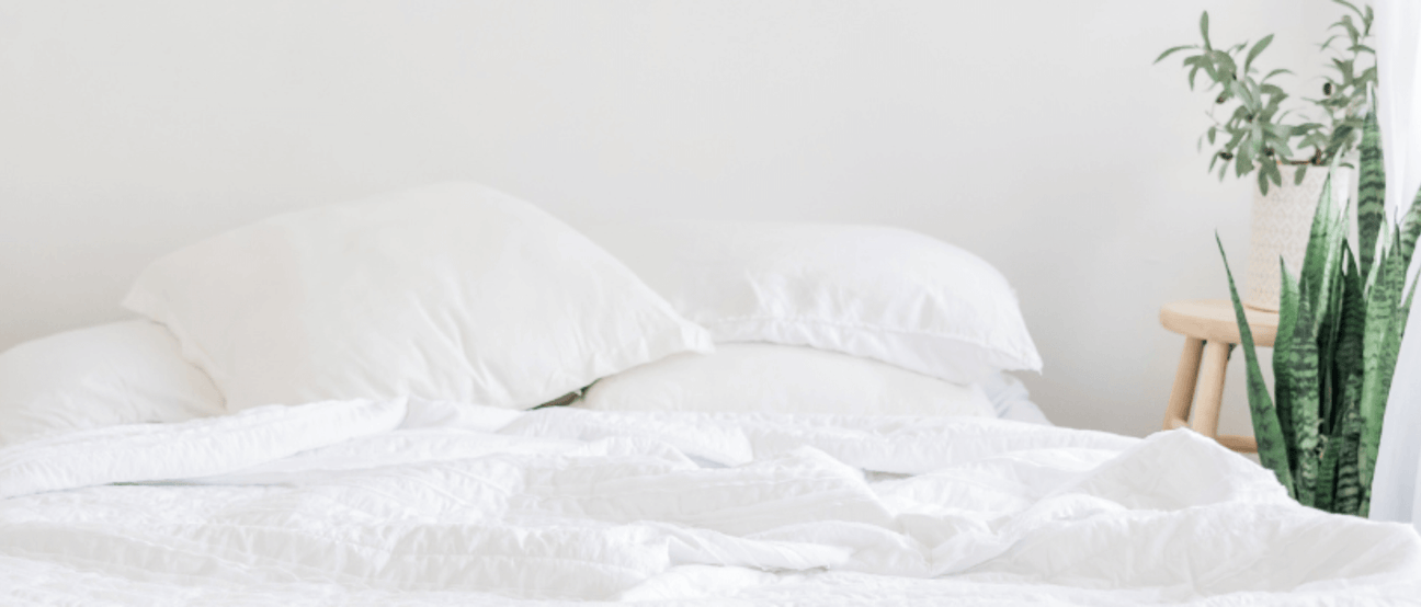 White cozy bed, symbolizing restful sleep.