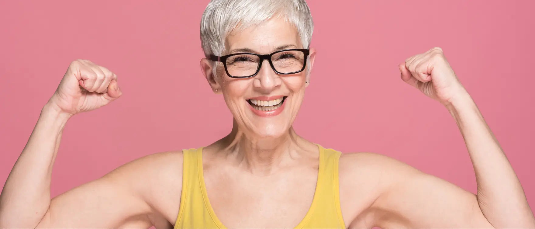 Confident woman showing strength — symbolizing strength training, GLP-1 balance, and turmeric wellness benefits