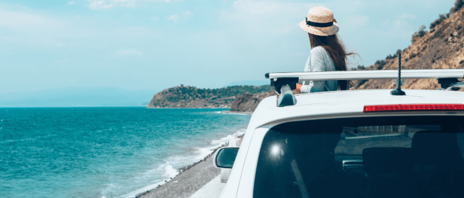 Scenic view of a coastal road during a summer road trip.