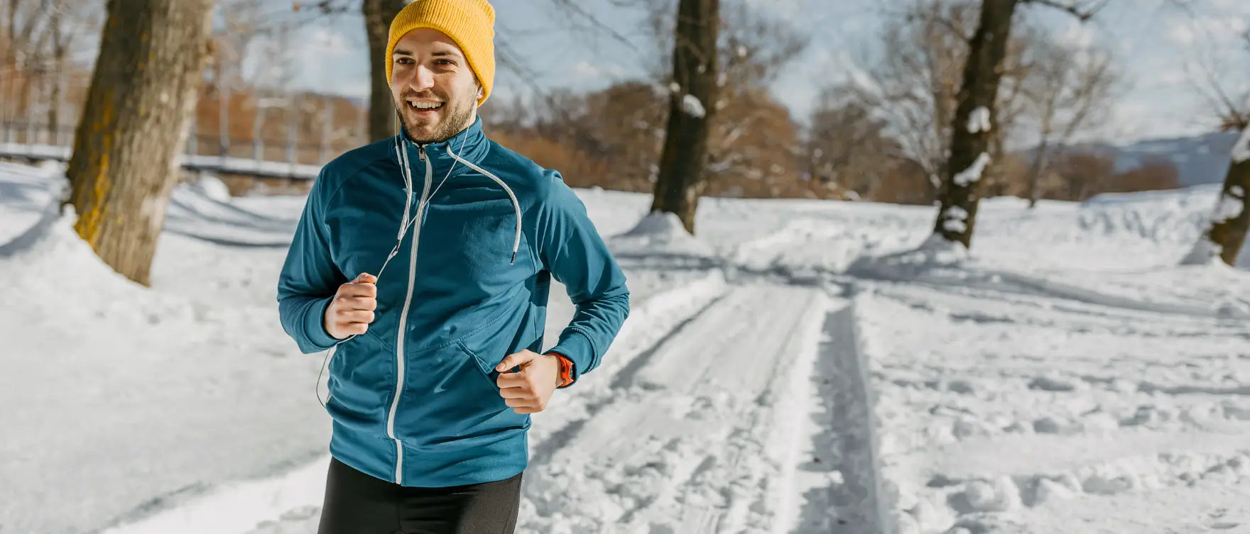 man jogging outdoors in winter snow to stay active and reduce inflammation naturally