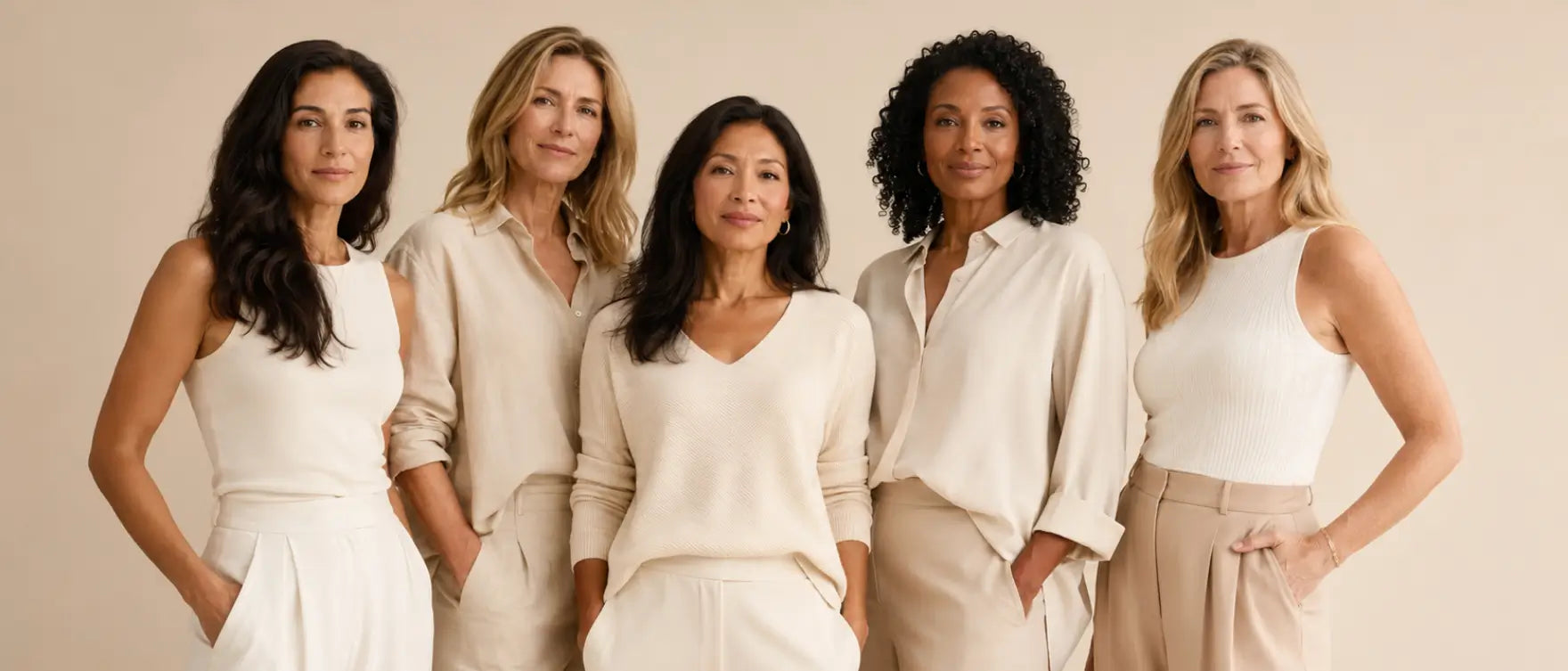 A diverse group of women standing together in soft neutral tones — representing the community and shared consistency behind lasting anti-inflammatory wellness habits