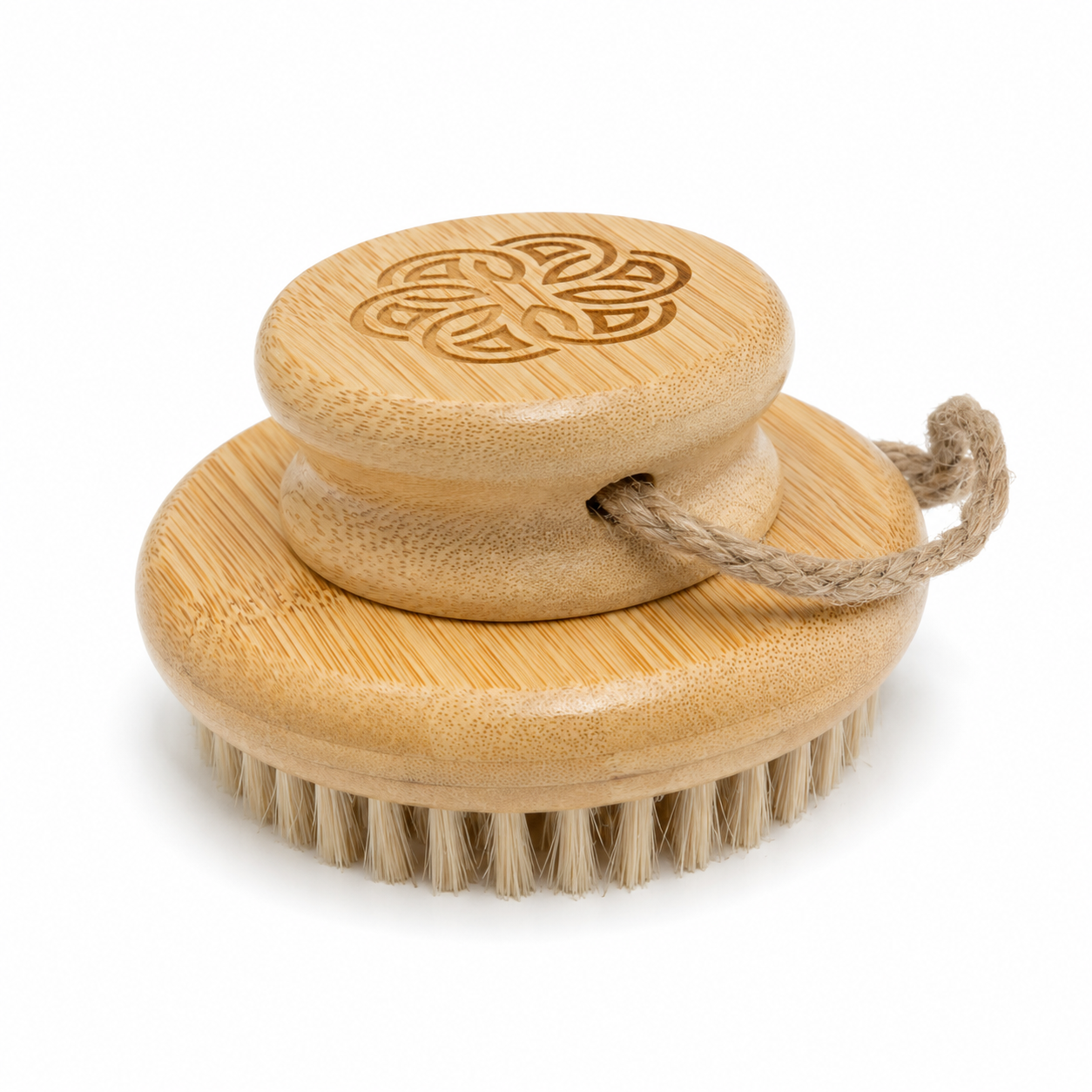 Wooden brush with a decorative handle on a white background