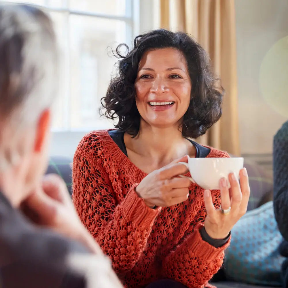 Woman drinking tea on the couch